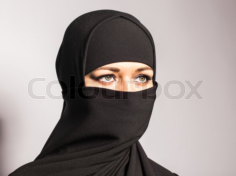 22568978-young-woman-wearing-niqab-on-background