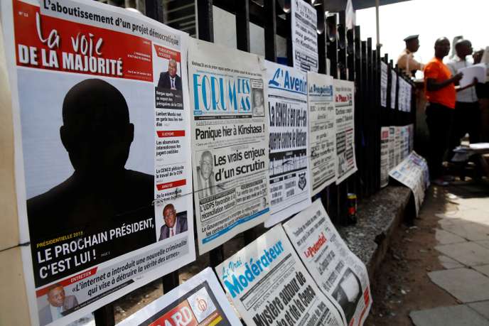 A Congolese news paper with the headline "The next president is him" is seen at a news stand in Kinshasa